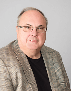 Headshot photograph of Chuck Kramer.